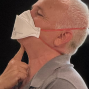 MaskFit+ instructor MaskFit+ instructor demonstrating where the bottom of the mask must be folded down and there cannot be any facial hair interrupting the seal.