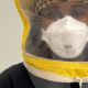 Close-up of a participant wearing a 3M Aura 1870+ N95 respirator beneath a yellow qualitative fit-testing hood.